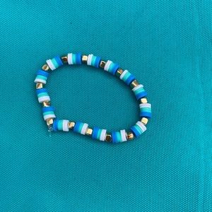 Handmade blue bracelet with gold squared bracelet